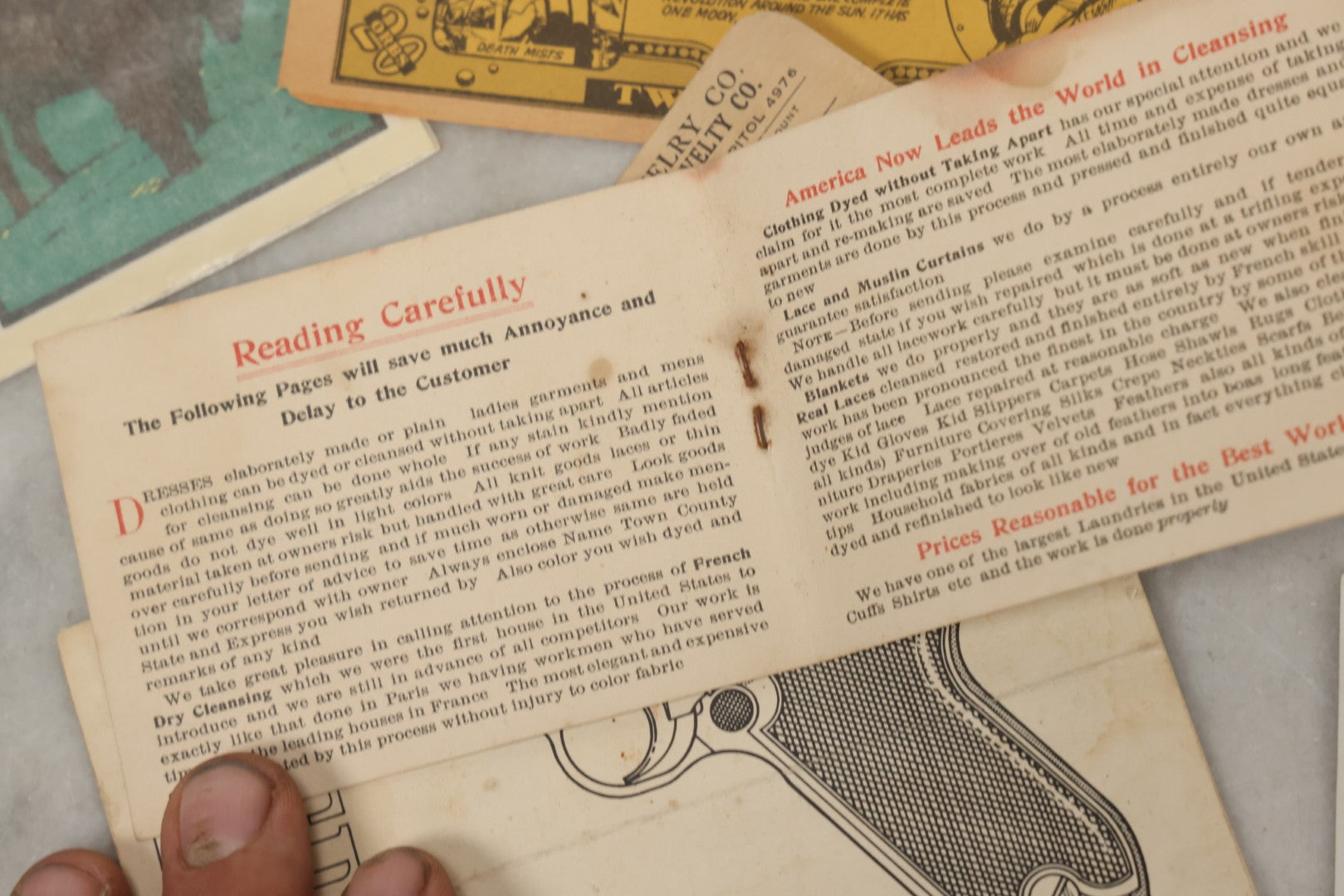 Lot 242 - Grouping Of 15 Antique And Vintage Mixed Ephemera Scraps Including Novelty Space Money From Neptune, 1882 Award Of Merit, Hand Motif Calling Cards, New England Jewelry Co. Coupon, Cat Booklet, Yellowstone Decal, And Erma EP22 Pistol Booklet