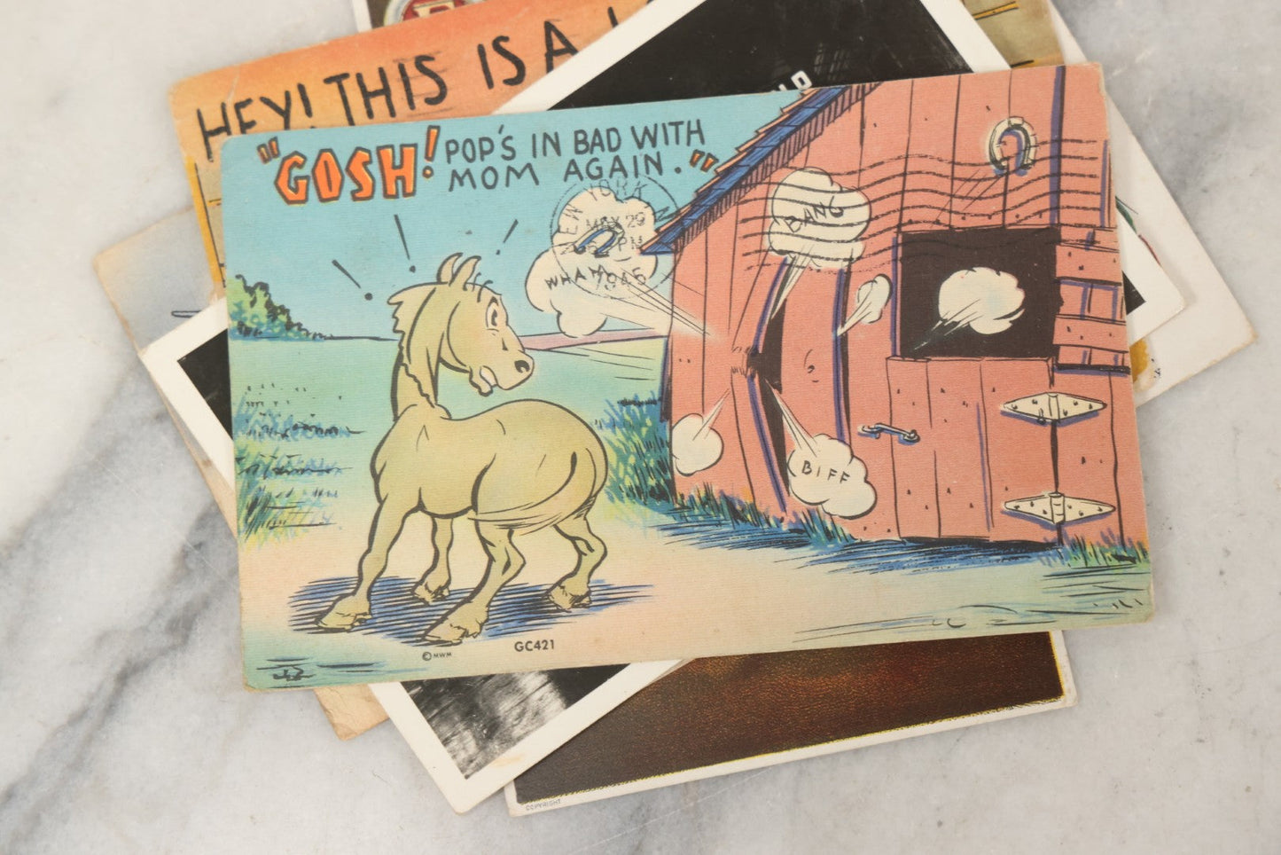 Lot 243 - Grouping Of 15 Antique And Vintage Postcards Including Fisk Tires And Shasta Water Advertising, Douglas Fairbanks Movie Promotion, Early Reno Undivided Back, Mythological Subjects, And Wwii Comic Cards