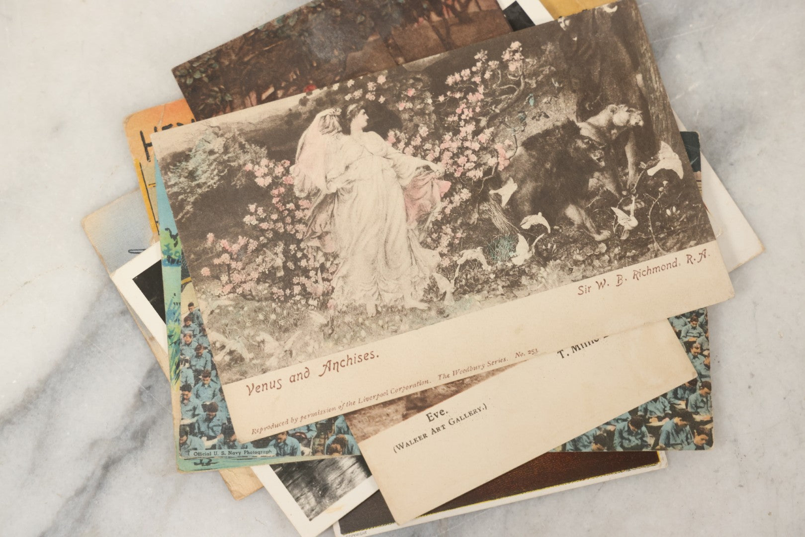 Lot 243 - Grouping Of 15 Antique And Vintage Postcards Including Fisk Tires And Shasta Water Advertising, Douglas Fairbanks Movie Promotion, Early Reno Undivided Back, Mythological Subjects, And Wwii Comic Cards