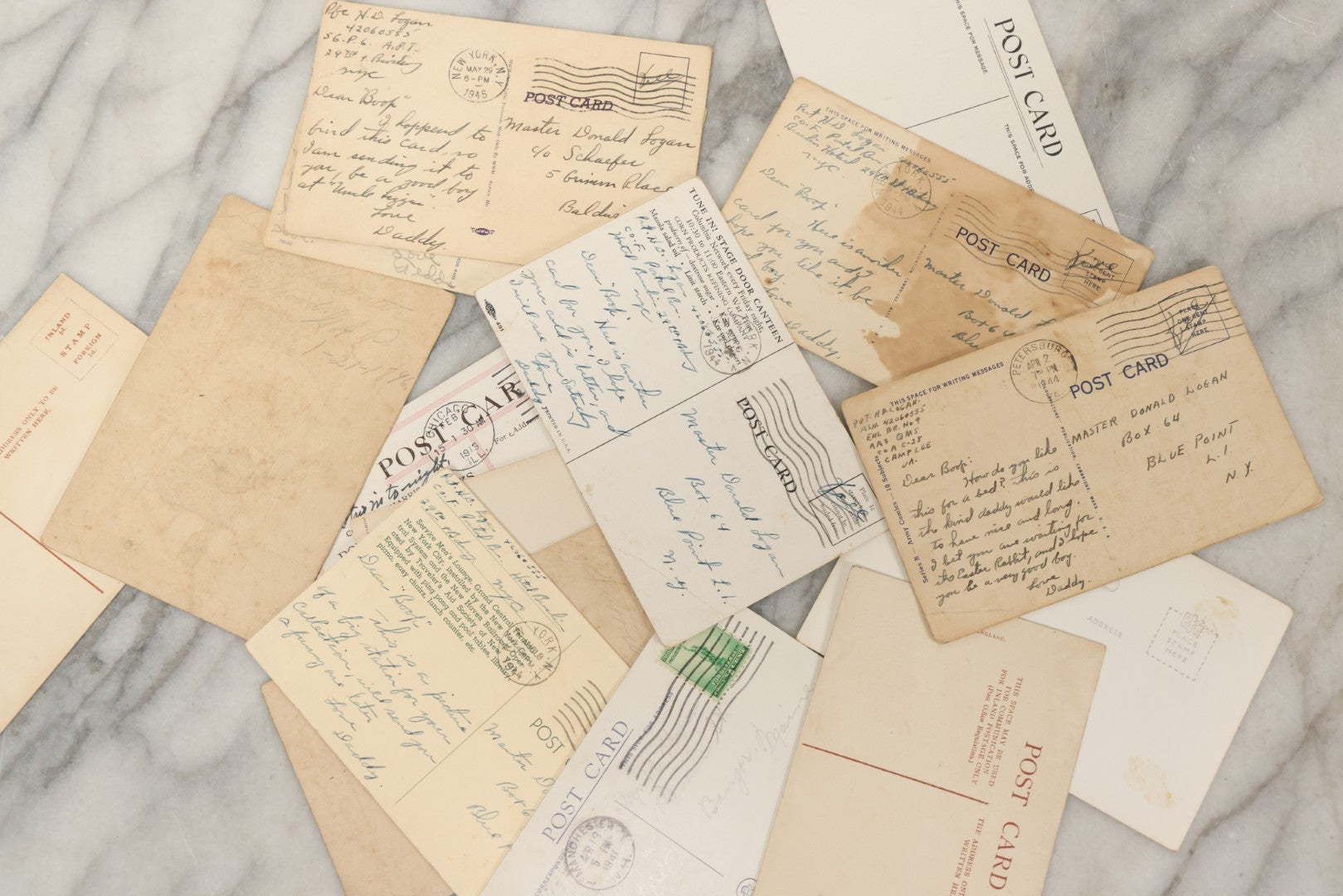 Lot 243 - Grouping Of 15 Antique And Vintage Postcards Including Fisk Tires And Shasta Water Advertising, Douglas Fairbanks Movie Promotion, Early Reno Undivided Back, Mythological Subjects, And Wwii Comic Cards