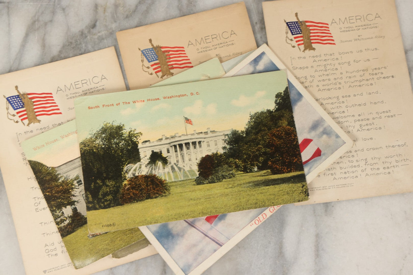 Lot 246 - Grouping Of Seven Antique And Vintage Patriotic Postcards, Including Three Copies Of "America" Poem By James Whitcomb Riley With Gilt Embossed Statue Of Liberty, Copyright 1907, Published By P.F. Volland & Co., Chicago, USA.