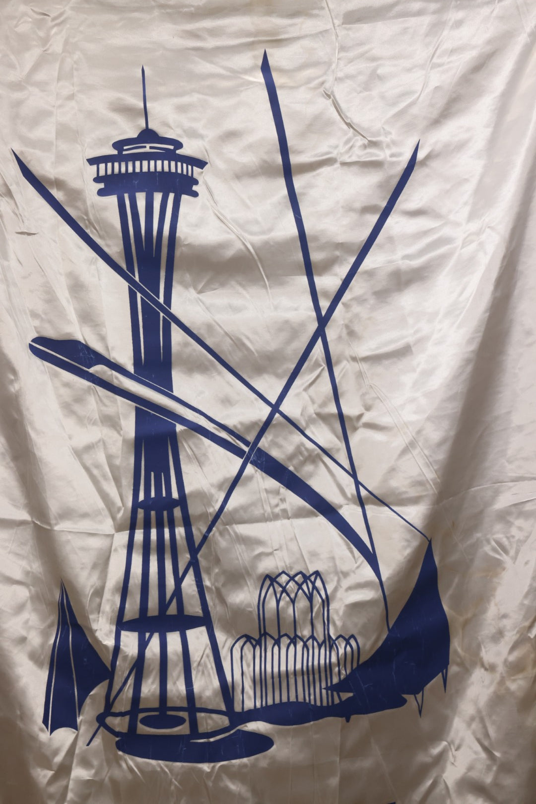 Lot 264 - Vintage Seattle World's Fair 1962 Nylon Flag Banner With Screen Printed Blue Graphics On White Field Featuring Space Needle And Other Landmarks, Yellow Fringe, Manufactured By Paramount Flag Co., San Francisco, California, 40-1/2" x 61-1/2"