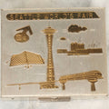 Lot 265 - Vintage Seattle World's Fair Chrome Compact With Mirror And Powder Pad Featuring Brass Landmarks Including Space Needle