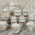 Lot 269 - Grouping Of Vintage And Antique Porcelain Miniatures Including German Spice Set Marked Germany With Coffee, Oil, Cinnamon, Flour, Vinegar, And Allspice Vessels, And Miniature Tea Set With Teapot, Cups, And Plates