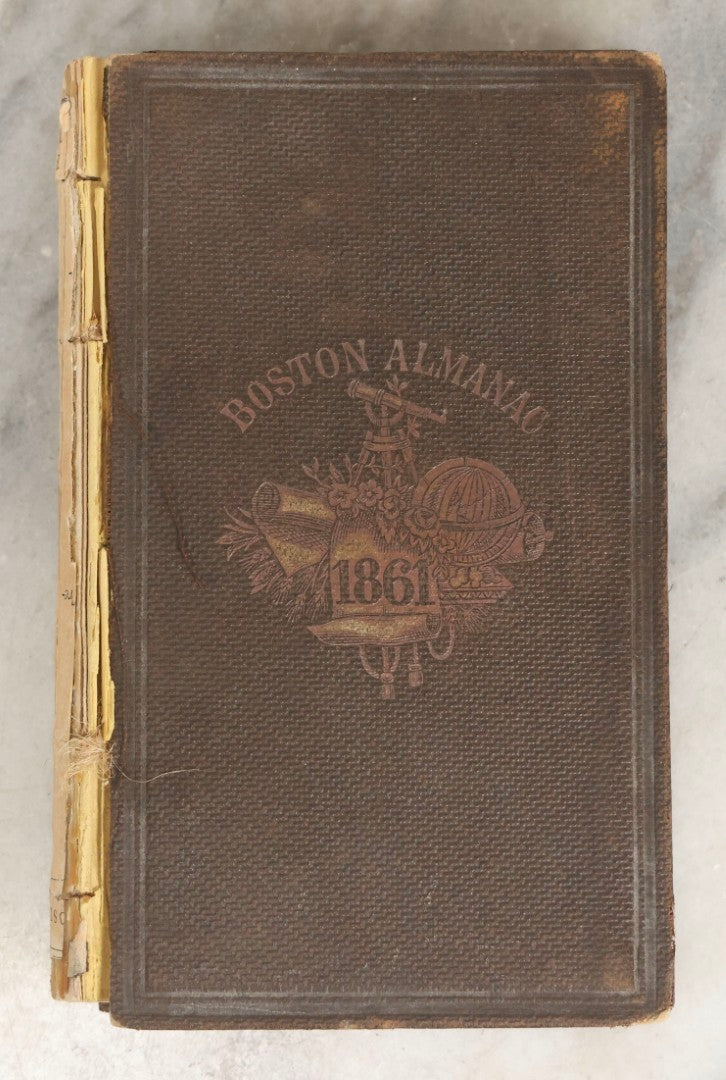 Lot 276 - "Boston Almanac 1861" Antique Illustrated Almanac Published In Boston, 1861, With Gilt Cover Design And Handwritten Monthly Memoranda, Note Poor Condition, Detached Covers