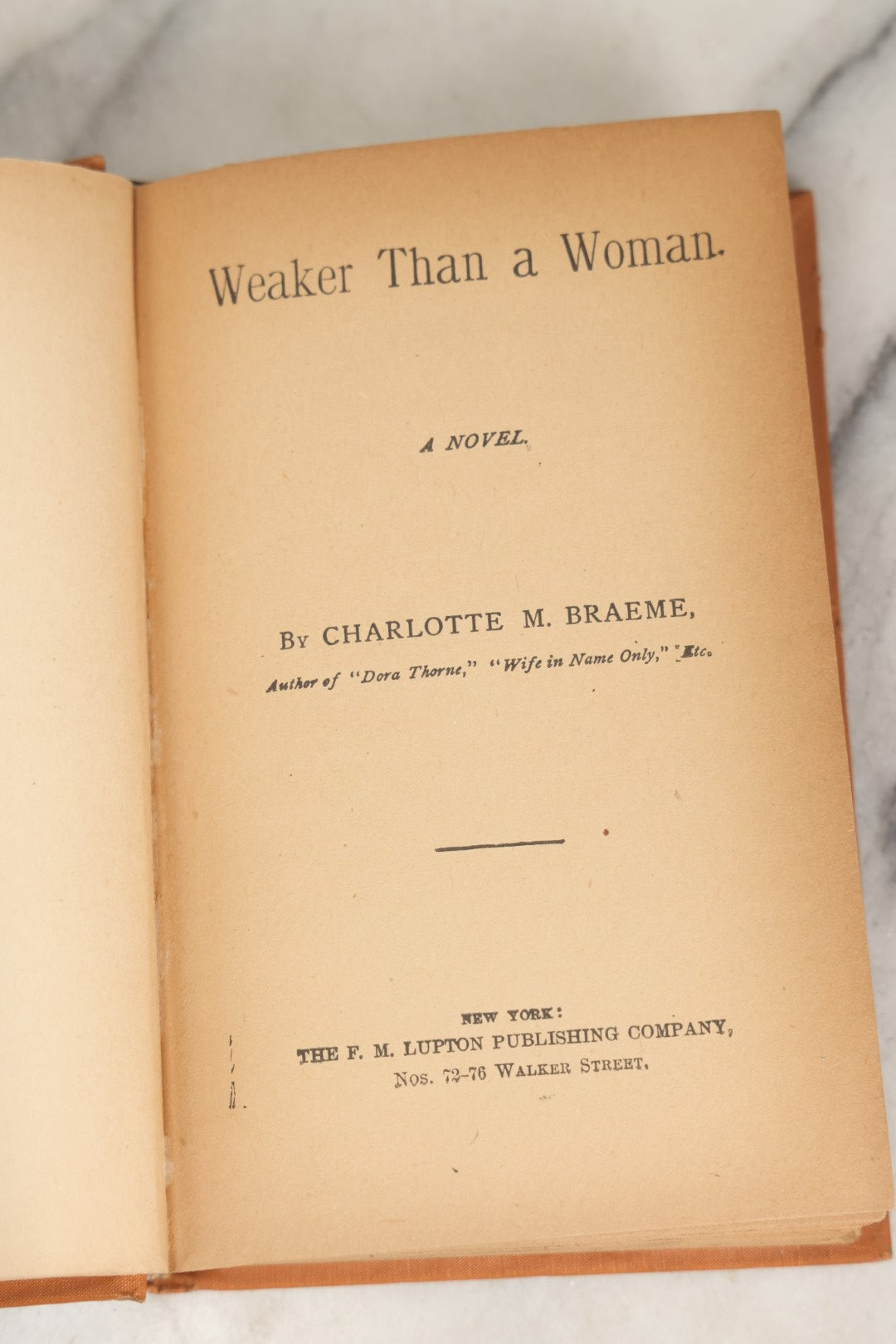 Lot 282 - "Weaker Than A Woman" Antique Romance Book By Charlotte M. Braeme, Published By The R. M. Lupton Publishing Company, New York, Avon Edition, Circa Late 19th Century