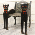Lot 001 - Vintage Folk Art Wooden Black Cat Child's Seat With Red Bow Ties And Domed Eyes, Hand Painted With Sponge Painted Texture Finish, Circa 1930s
