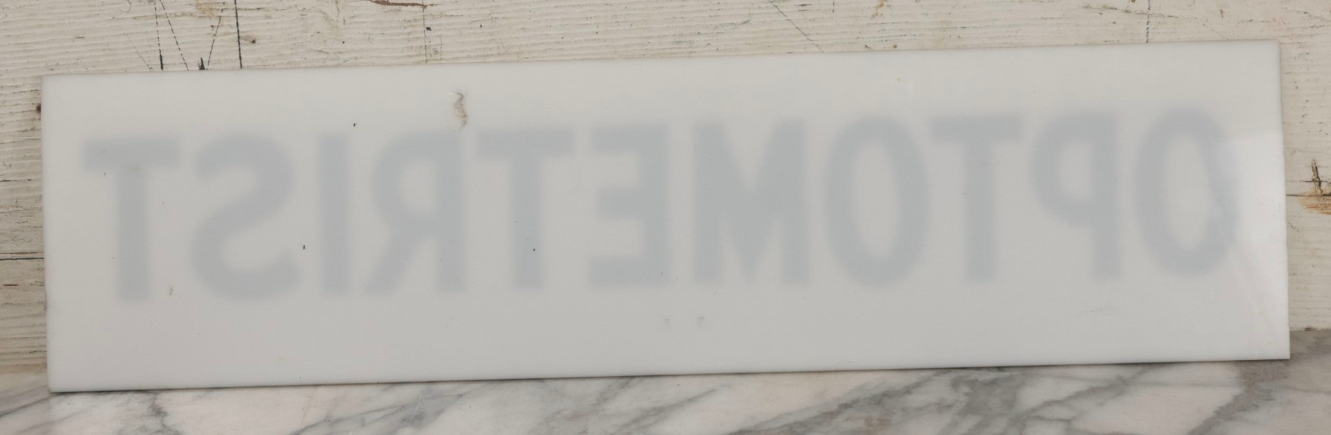 Lot 011 - Vintage Hand-Painted "Optometrist" Trade Sign On White Plexiglass, 23-1/2" x 6"