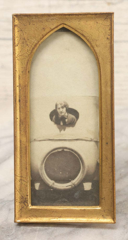 Lot 106 - Antique Framed Photograph Of Woman In Early Automobile With Spare Tire Visible, In Gold Painted Metal Pointed Arch Frame, 2-1/2" x 5"