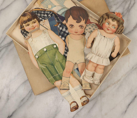 Lot 136 - Antique Box Lot Of Paper Dolls And Clothing, Including Hand Drawn Outfits And Mechanical "Susan" Doll By Sam'L Gabriel Sons & Company, Printed In Germany, 1919