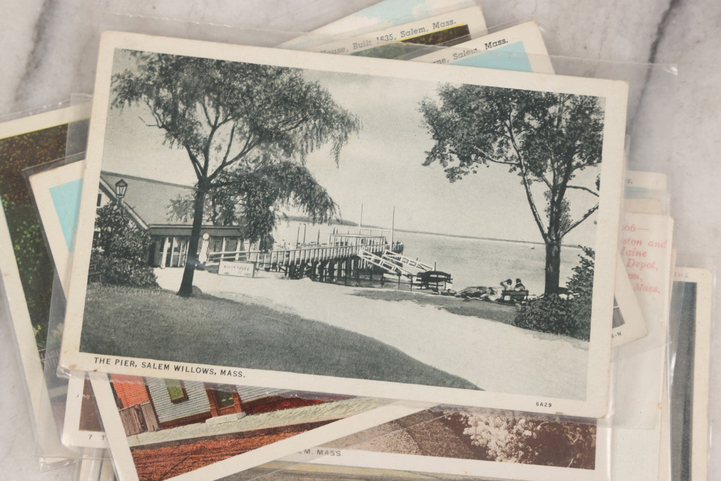 Lot 144 - Grouping Of 40+ Antique And Vintage Salem, Massachusetts Postcards Including 13 Individual Views Featuring House Of The Seven Gables And Old Witch House, And Many Duplicates Showing Salem And Empire Theaters On Essex Street