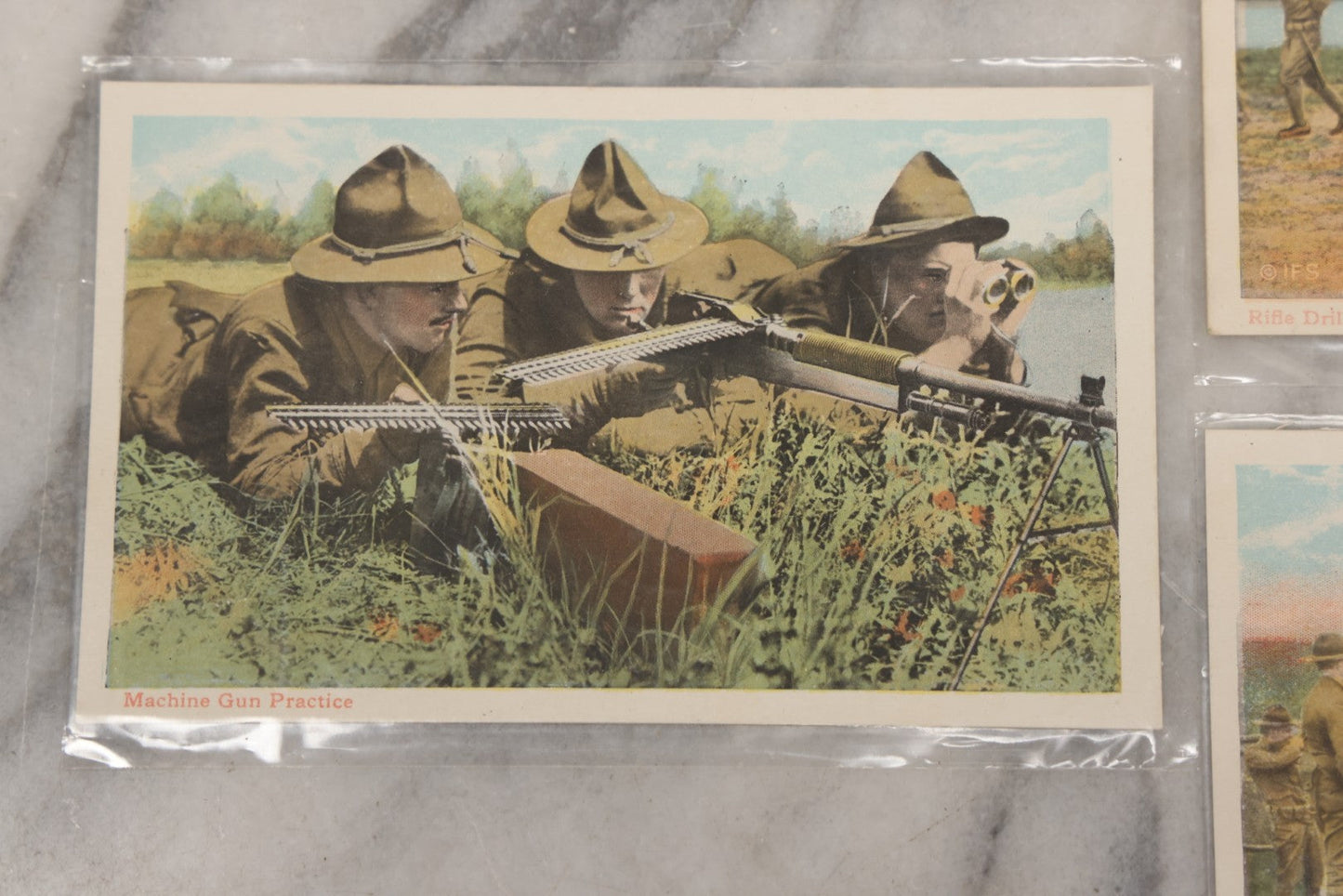 Lot 145 - Grouping Of 12 Antique World War I Soldier Training Postcards With Original Souvenir Folder, Series No. 1, Illustrated Postal Card & Novelty Co., New York