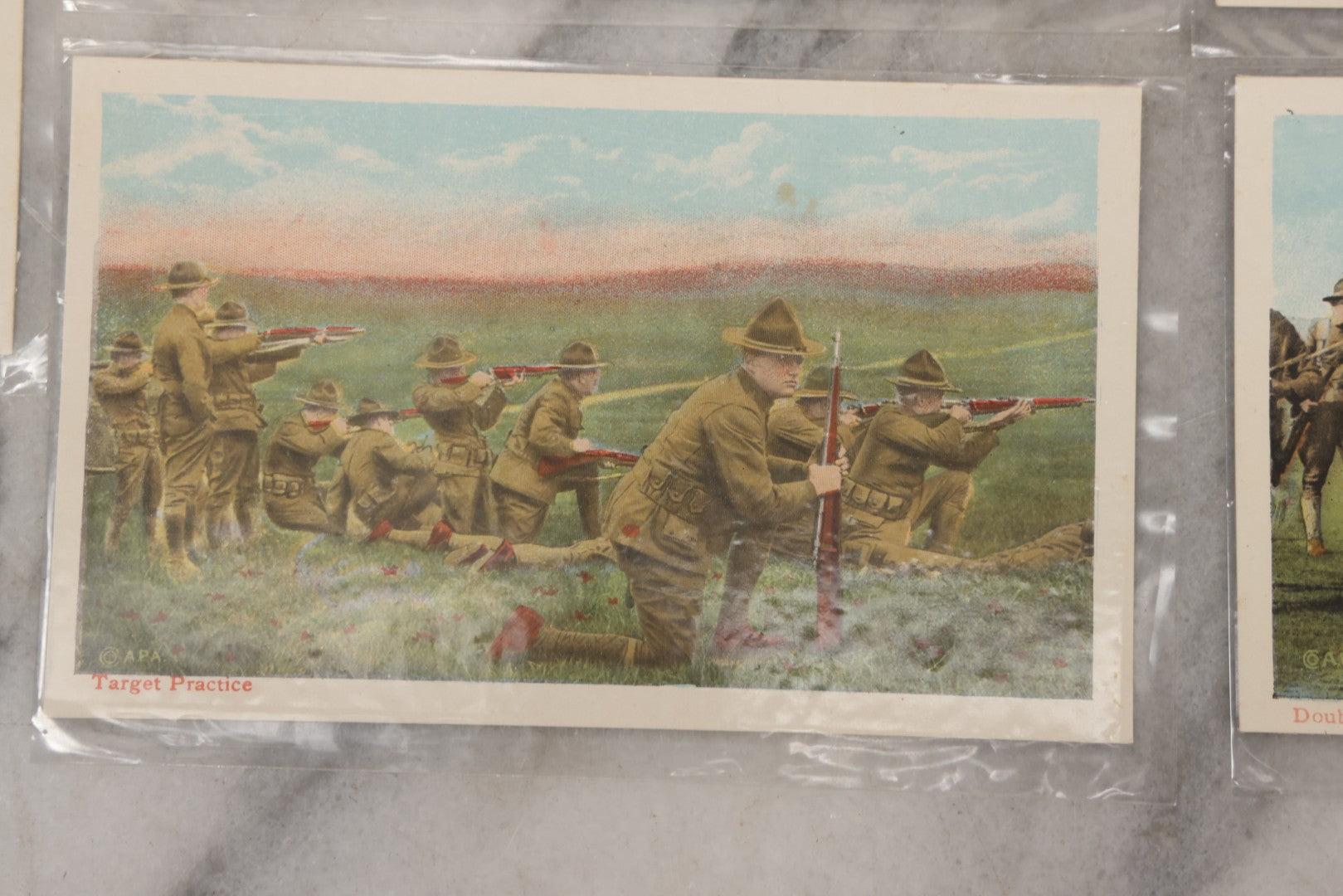 Lot 145 - Grouping Of 12 Antique World War I Soldier Training Postcards With Original Souvenir Folder, Series No. 1, Illustrated Postal Card & Novelty Co., New York