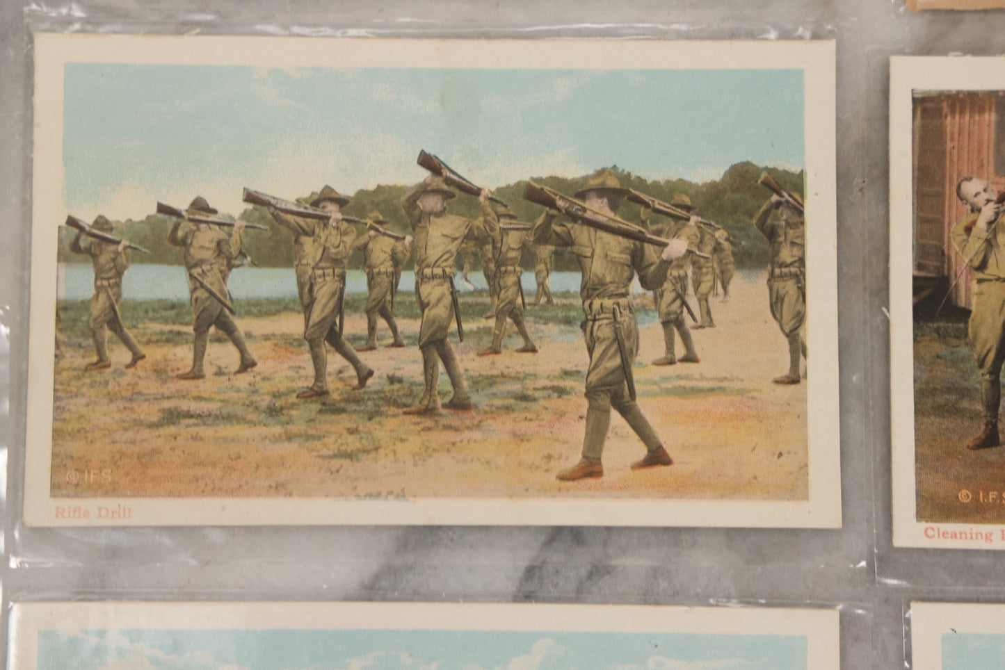 Lot 145 - Grouping Of 12 Antique World War I Soldier Training Postcards With Original Souvenir Folder, Series No. 1, Illustrated Postal Card & Novelty Co., New York