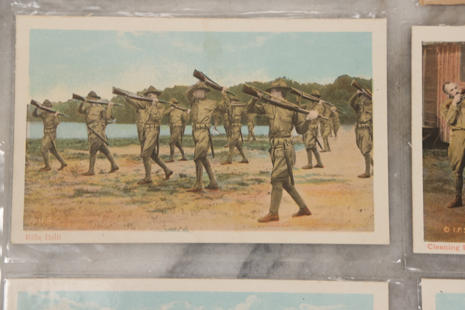 Lot 145 - Grouping Of 12 Antique World War I Soldier Training Postcards With Original Souvenir Folder, Series No. 1, Illustrated Postal Card & Novelty Co., New York