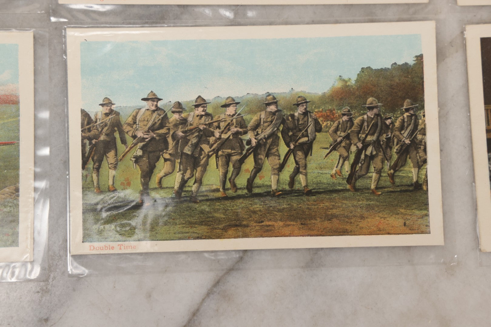 Lot 145 - Grouping Of 12 Antique World War I Soldier Training Postcards With Original Souvenir Folder, Series No. 1, Illustrated Postal Card & Novelty Co., New York
