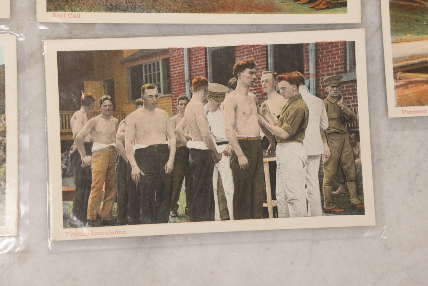 Lot 145 - Grouping Of 12 Antique World War I Soldier Training Postcards With Original Souvenir Folder, Series No. 1, Illustrated Postal Card & Novelty Co., New York