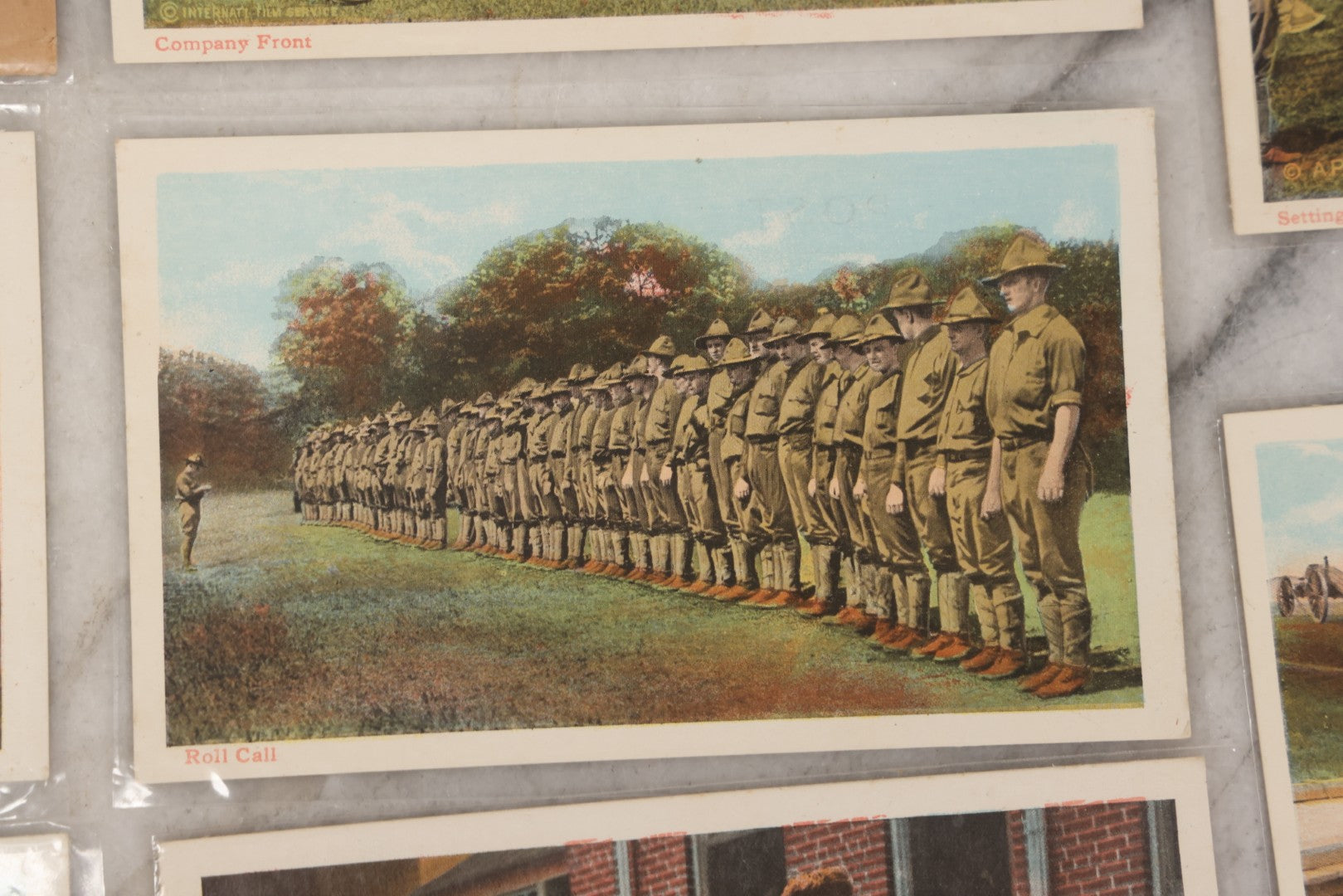 Lot 145 - Grouping Of 12 Antique World War I Soldier Training Postcards With Original Souvenir Folder, Series No. 1, Illustrated Postal Card & Novelty Co., New York