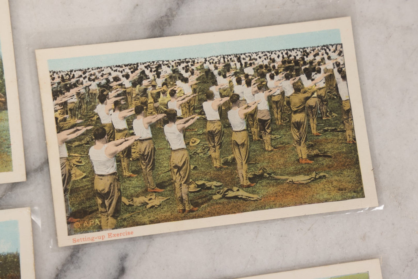Lot 145 - Grouping Of 12 Antique World War I Soldier Training Postcards With Original Souvenir Folder, Series No. 1, Illustrated Postal Card & Novelty Co., New York