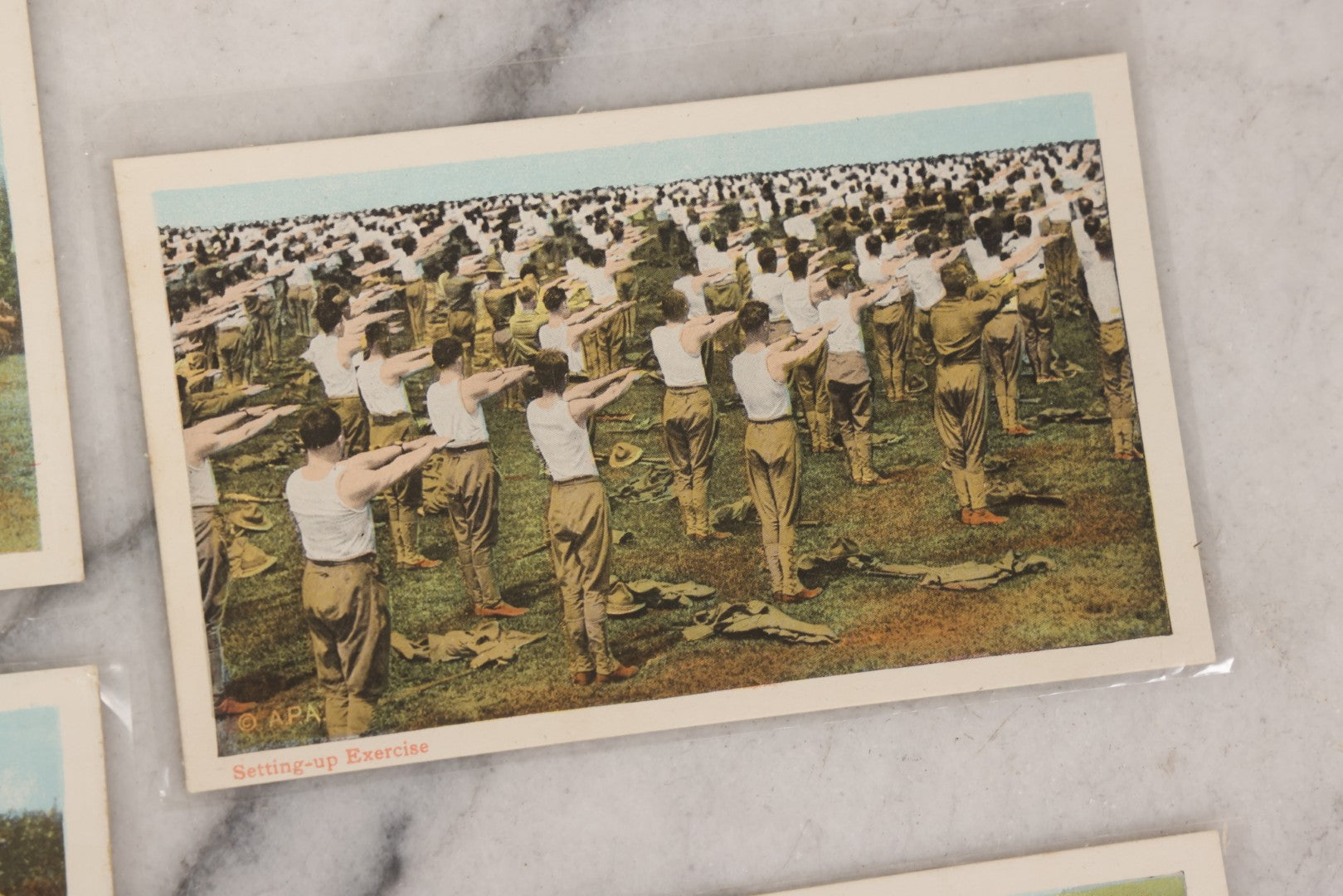 Lot 145 - Grouping Of 12 Antique World War I Soldier Training Postcards With Original Souvenir Folder, Series No. 1, Illustrated Postal Card & Novelty Co., New York