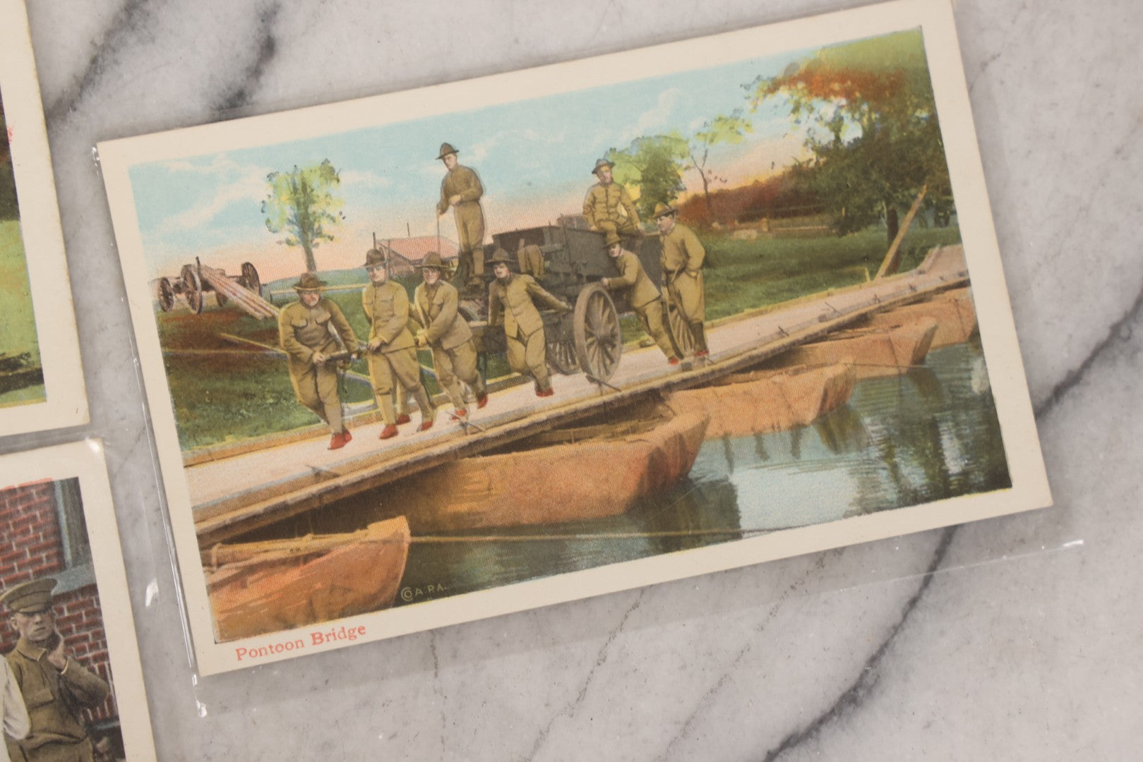 Lot 145 - Grouping Of 12 Antique World War I Soldier Training Postcards With Original Souvenir Folder, Series No. 1, Illustrated Postal Card & Novelty Co., New York