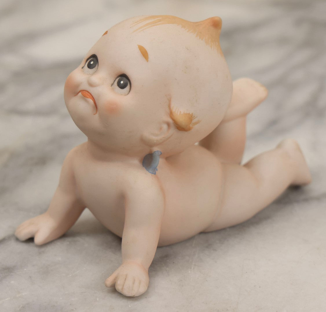 Lot 150 - Pair Of Antique Bisque Kewpie Dolls, One In Wicker Rocking Crib With Lace Bedding
