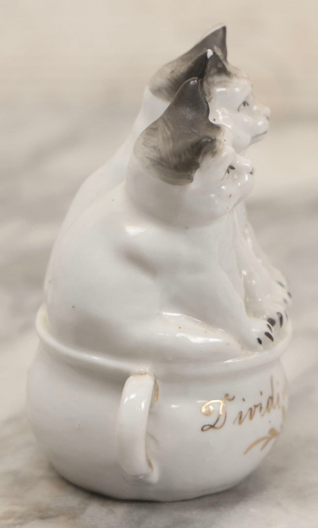 Lot 155 - Antique Porcelain Figure Of Two Cats On Cup, "Dividing The Pot" Gilt Lettering, 3-3/4" H