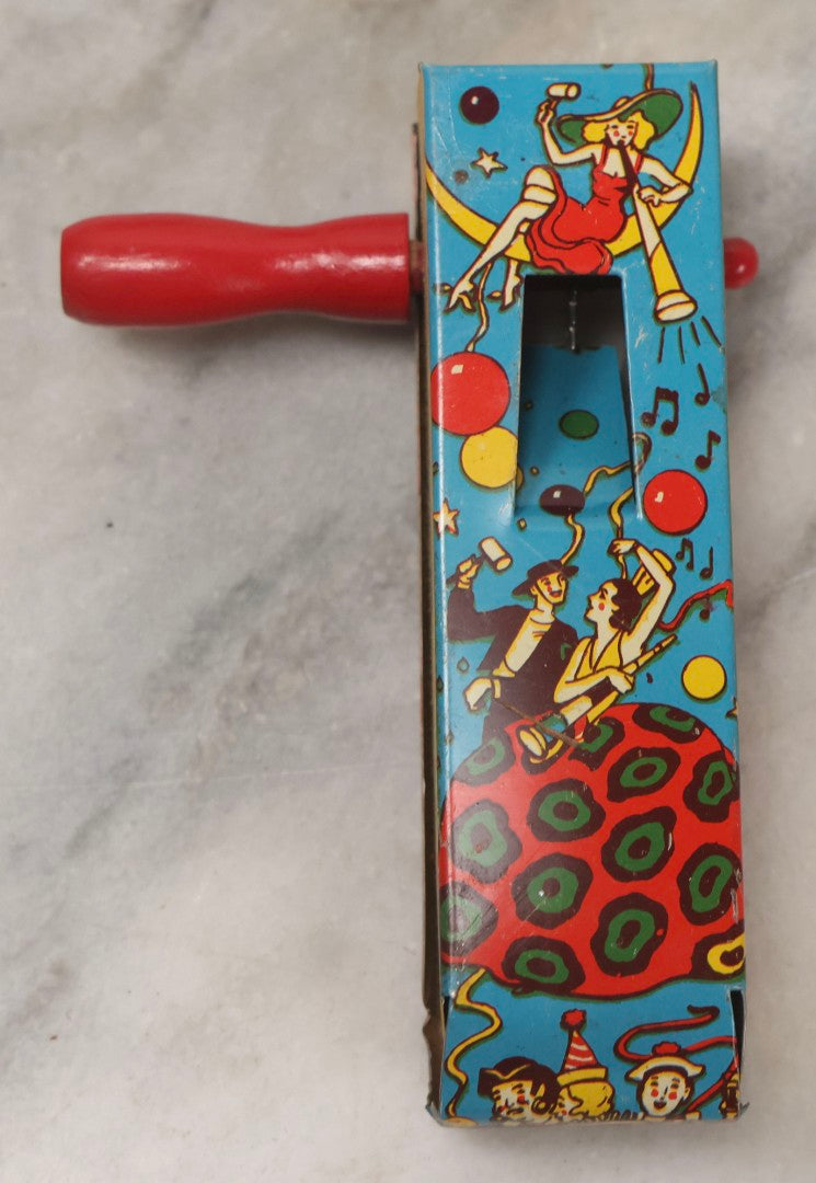 Lot 179 - Grouping Of Seven Vintage And Antique Tin Lithograph Noisemaker Toys Including Dancing Clowns, Woman In Martini Glass, Party Scenes, And Animal Top