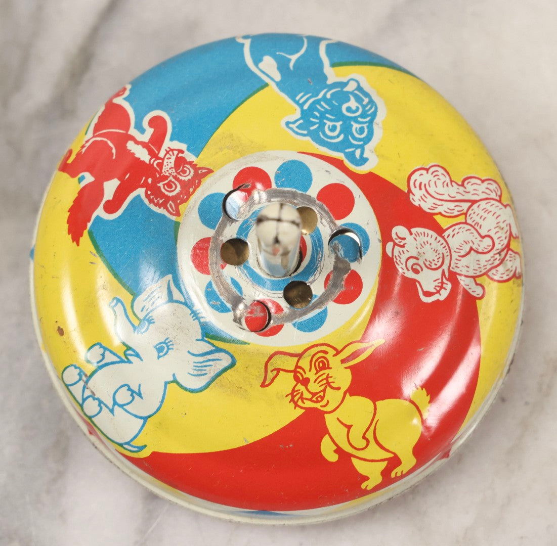 Lot 179 - Grouping Of Seven Vintage And Antique Tin Lithograph Noisemaker Toys Including Dancing Clowns, Woman In Martini Glass, Party Scenes, And Animal Top