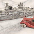 Lot 181 - Pair Of Vintage Metal Toy Vehicles Including "Tootsietoy" Red Car, 3" L, And Battleship, 5-3/4" L