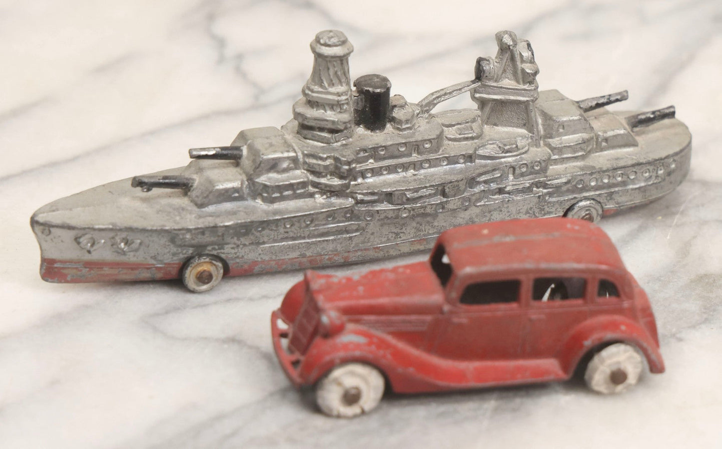 Lot 181 - Pair Of Vintage Metal Toy Vehicles Including "Tootsietoy" Red Car, 3" L, And Battleship, 5-3/4" L