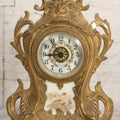 Lot 012 - Antique Waterbury Clock Co. Gold-Painted Spelter Mantel Clock With Hand-Painted Dial And Cupid Scene Panel, Circa 1890s Working Condition, 11" H