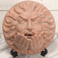 Lot 020 - Vintage Unglazed Ceramic Greenman Wall Plaque With Relief Face Blowing Over Pair Of Hands, Cold-Painted Surface, Marked "B P" On Verso, 13-3/4" Diameter