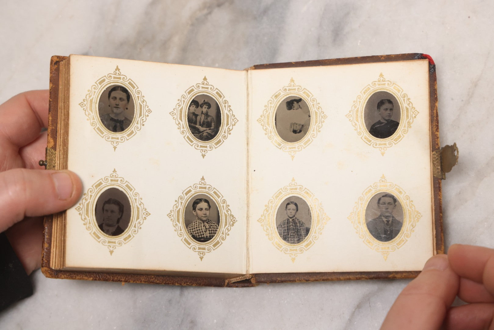 Lot 041 - Antique Complete Gem Tintype Photo Album Containing 96 Images On 12 Double-Sided Pages, Including Boy With Dog, Group And Pair Portraits, And Finely Executed Individual Studies