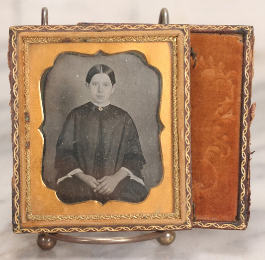Lot 043 - Antique 1/6th Plate Daguerreotype Photograph Of Young Married Woman With Hand-Painted Gold Jewelry, In Full Split Leatherette Union Case With Embossed Bouquet Design