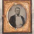 Lot 048 - Antique 1/6th Plate Ruby Ambrotype Photograph Of Skeptical-Looking Middle-Aged Man In Bowtie, White Shirt, And Blazer, In Half Leatherette Union Case