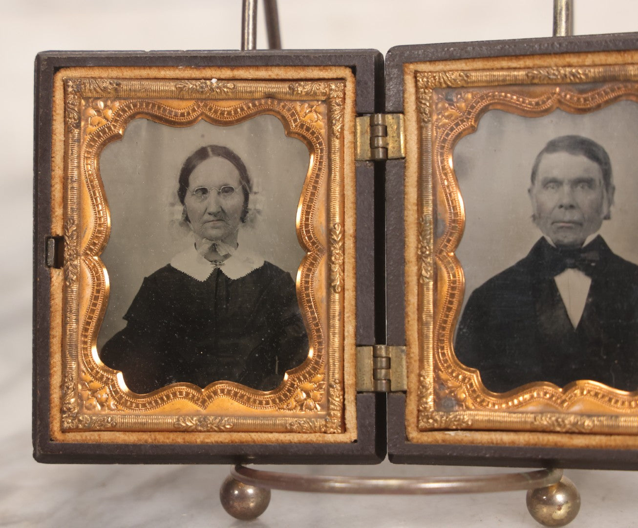 Lot 050 - Pair Of Antique 1/9th Plate Ruby Ambrotype Photographs Of Elderly Married Couple In Littlefield, Parsons & Co. Double Thermoplastic Union Case, Patented 1856–1857, With Herald Design