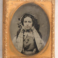 Lot 053 - Antique 1/9th Plate Ruby Ambrotype Photograph Of Pretty Young Woman In Elaborate Bonnet And Coat With Long Bonnet Ties Draped Across Chest, Uncased With Brass Mat And Preserver