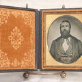 Lot 057 - Antique 1/6th Plate Ambrotype Photograph Of Bearded Man In Silk Neck Tie And Formal Dress, In Full Leatherette Union Case Repaired With Tape Hinge