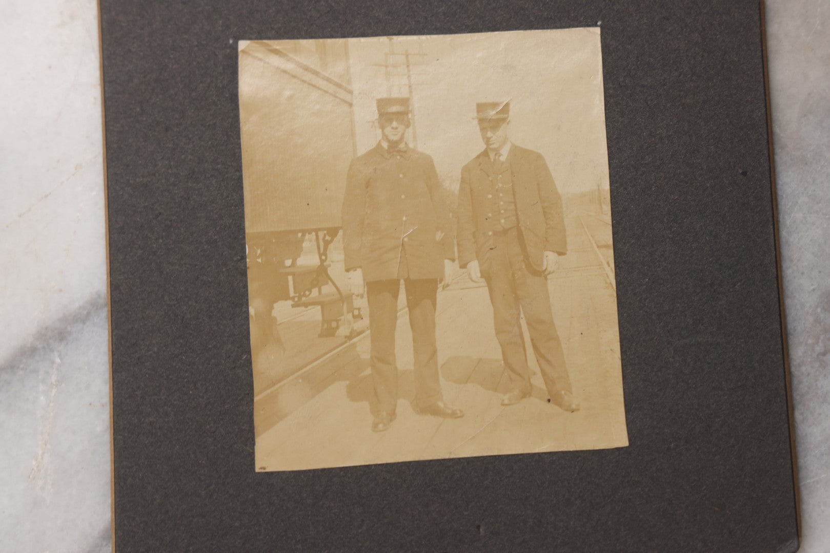 Lot 080 - Pair Of Antique Boarded Photographs Including Passengers Posing Beside Train Car With Handwritten Caption Referring To A Picnic, And Two Railroad Conductors Or Ticket Takers In Uniform
