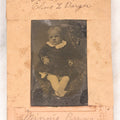 Lot 087 - Antique Tintype Photograph Of Baby In Mother's Lap, A “Not-So-Hidden Mother” Portrait, Identified As Minnie Barger, Daughter Of John J. And Elma L. Barger, In Makeshift Paper Frame