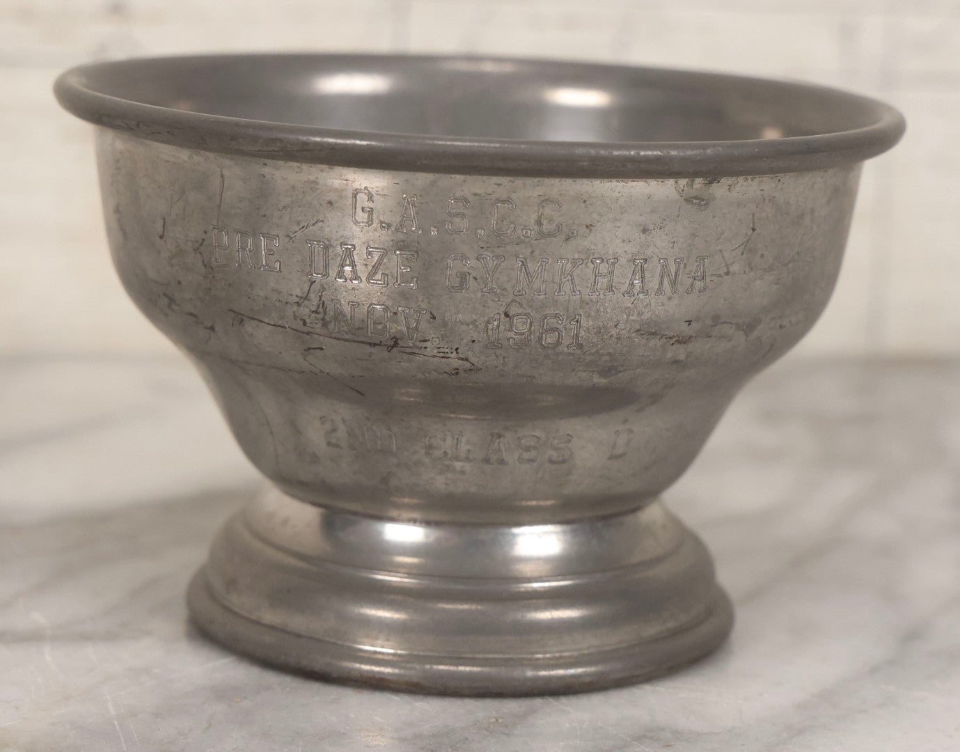 Lot 098 - Grouping Of 10 Vintage Pewter Gymkhana And Rally Trophies, 1959–1964, Various Makers Including Queen Art Pewter, Trinac Pewter, And Royal Holland Pewter