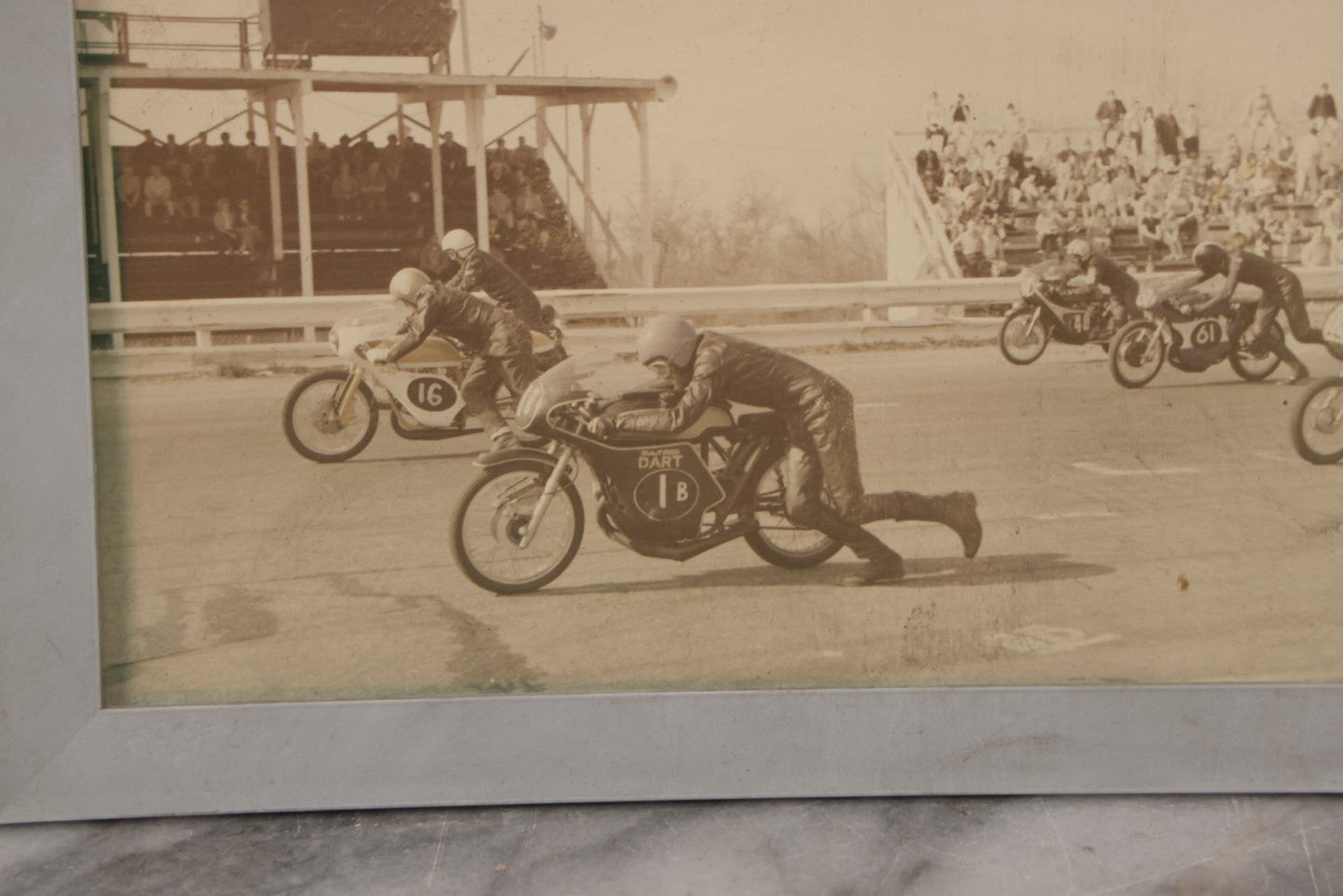 Lot 101 - Vintage Photograph Of Early Motorcycle Race Start, Racers Running Alongside Bikes, In Plastic Frame, 7-1/2" x 5-1/2"