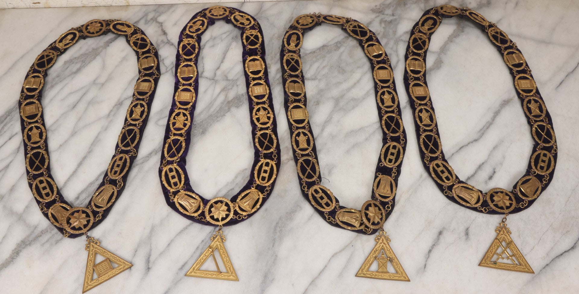 Lot 109 - Grouping Of Four Antique Odd Fellows I.O.O.F.. Purple Chain Collars By Harding Uniform & Regalia Co., Boston, And Fuller Regalia & Costume, Worcester, Massachusetts, With Symbolic Medallions