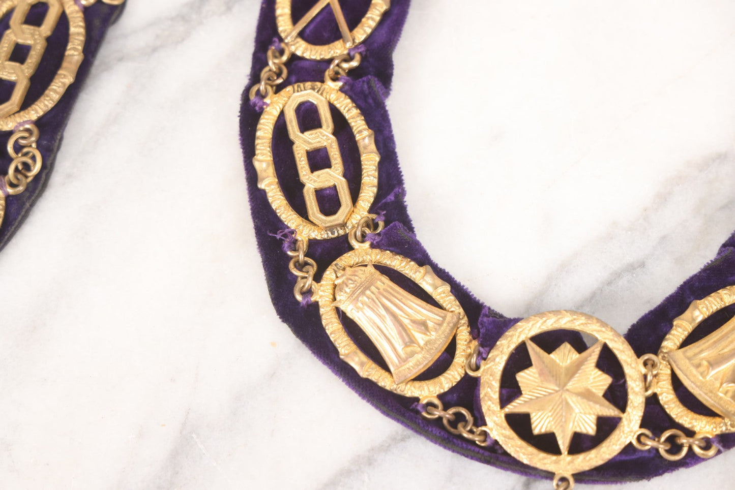 Lot 109 - Grouping Of Four Antique Odd Fellows I.O.O.F.. Purple Chain Collars By Harding Uniform & Regalia Co., Boston, And Fuller Regalia & Costume, Worcester, Massachusetts, With Symbolic Medallions