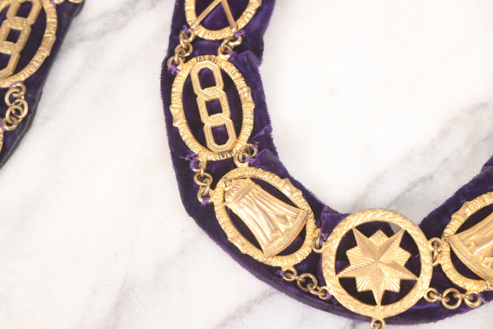 Lot 109 - Grouping Of Four Antique Odd Fellows I.O.O.F.. Purple Chain Collars By Harding Uniform & Regalia Co., Boston, And Fuller Regalia & Costume, Worcester, Massachusetts, With Symbolic Medallions