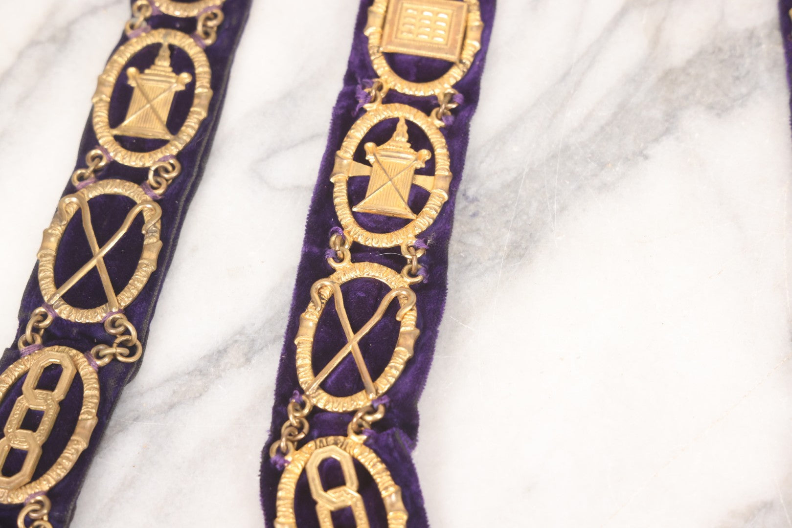 Lot 109 - Grouping Of Four Antique Odd Fellows I.O.O.F.. Purple Chain Collars By Harding Uniform & Regalia Co., Boston, And Fuller Regalia & Costume, Worcester, Massachusetts, With Symbolic Medallions