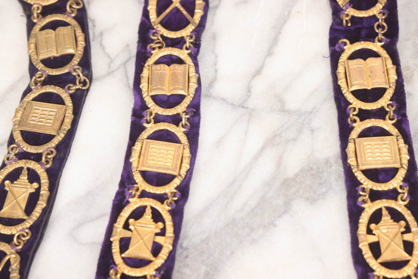 Lot 109 - Grouping Of Four Antique Odd Fellows I.O.O.F.. Purple Chain Collars By Harding Uniform & Regalia Co., Boston, And Fuller Regalia & Costume, Worcester, Massachusetts, With Symbolic Medallions