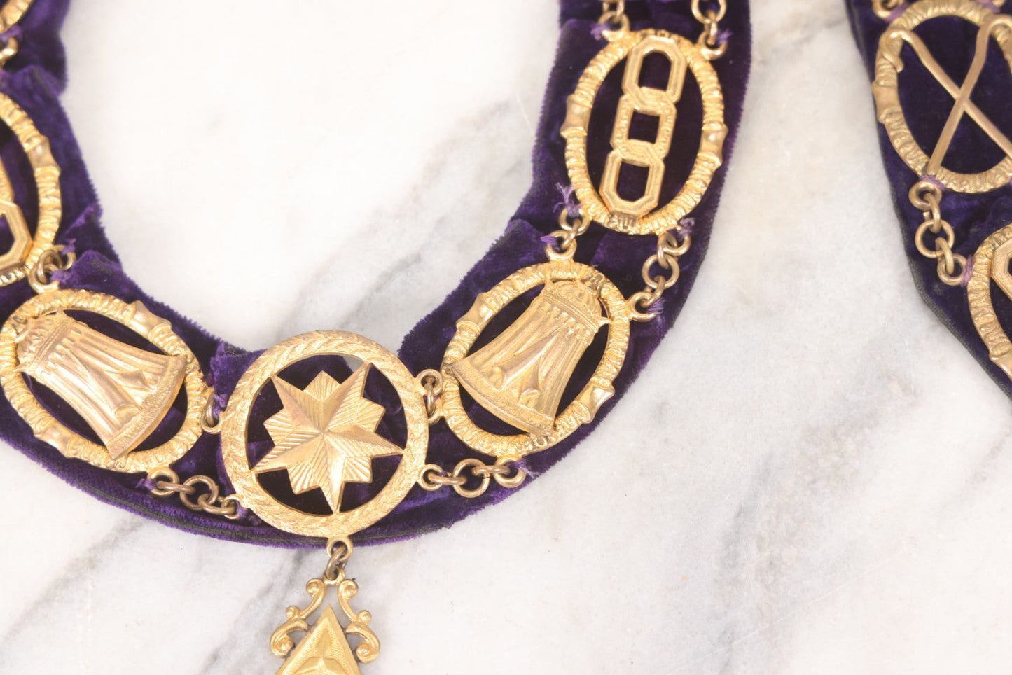 Lot 109 - Grouping Of Four Antique Odd Fellows I.O.O.F.. Purple Chain Collars By Harding Uniform & Regalia Co., Boston, And Fuller Regalia & Costume, Worcester, Massachusetts, With Symbolic Medallions