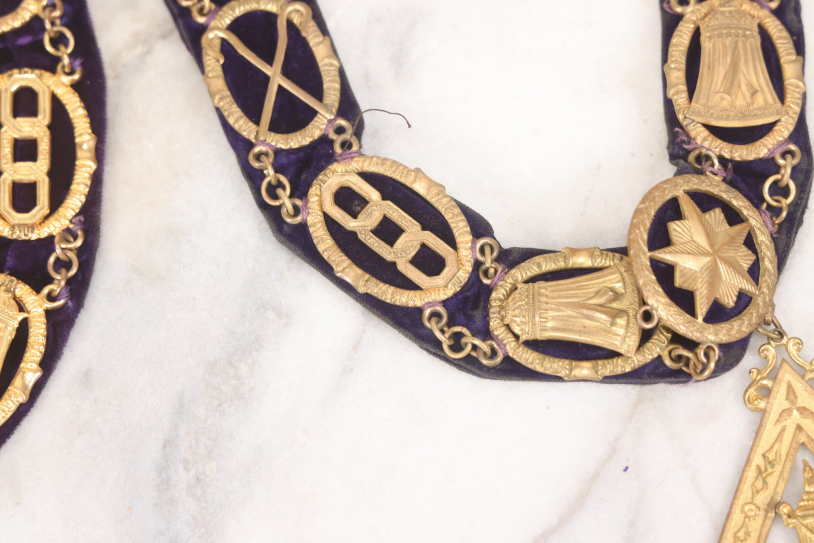 Lot 109 - Grouping Of Four Antique Odd Fellows I.O.O.F.. Purple Chain Collars By Harding Uniform & Regalia Co., Boston, And Fuller Regalia & Costume, Worcester, Massachusetts, With Symbolic Medallions